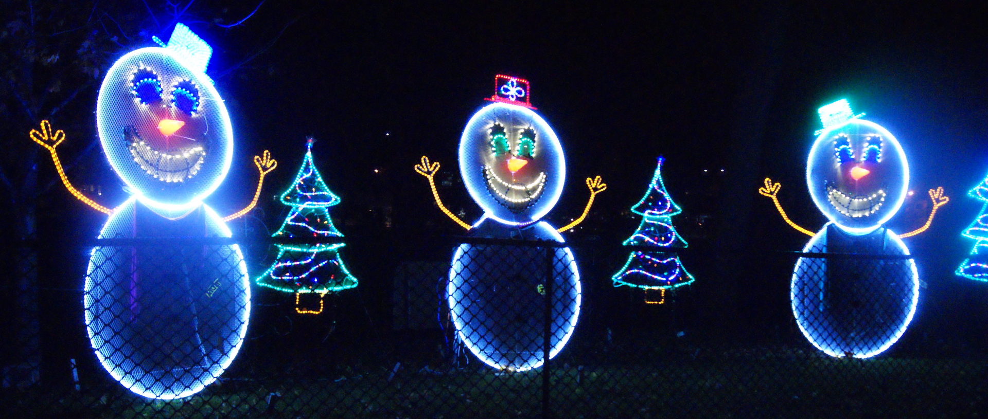 image of 3 light based snowmen in a row