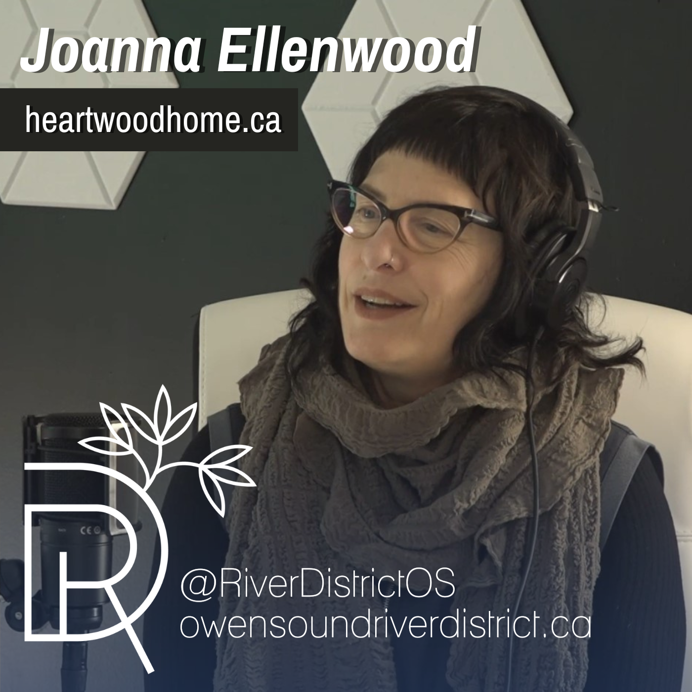 Joanna Ellenwood in podcast studio with headphones and in front of microphone