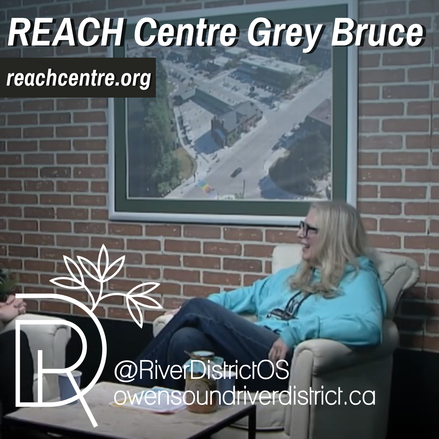 image of woman in front of faux brick wall